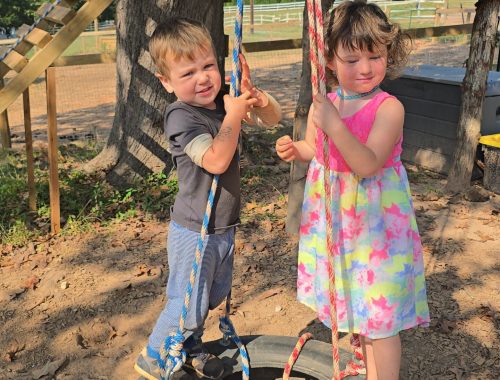 Sephira and kid in the tire swing